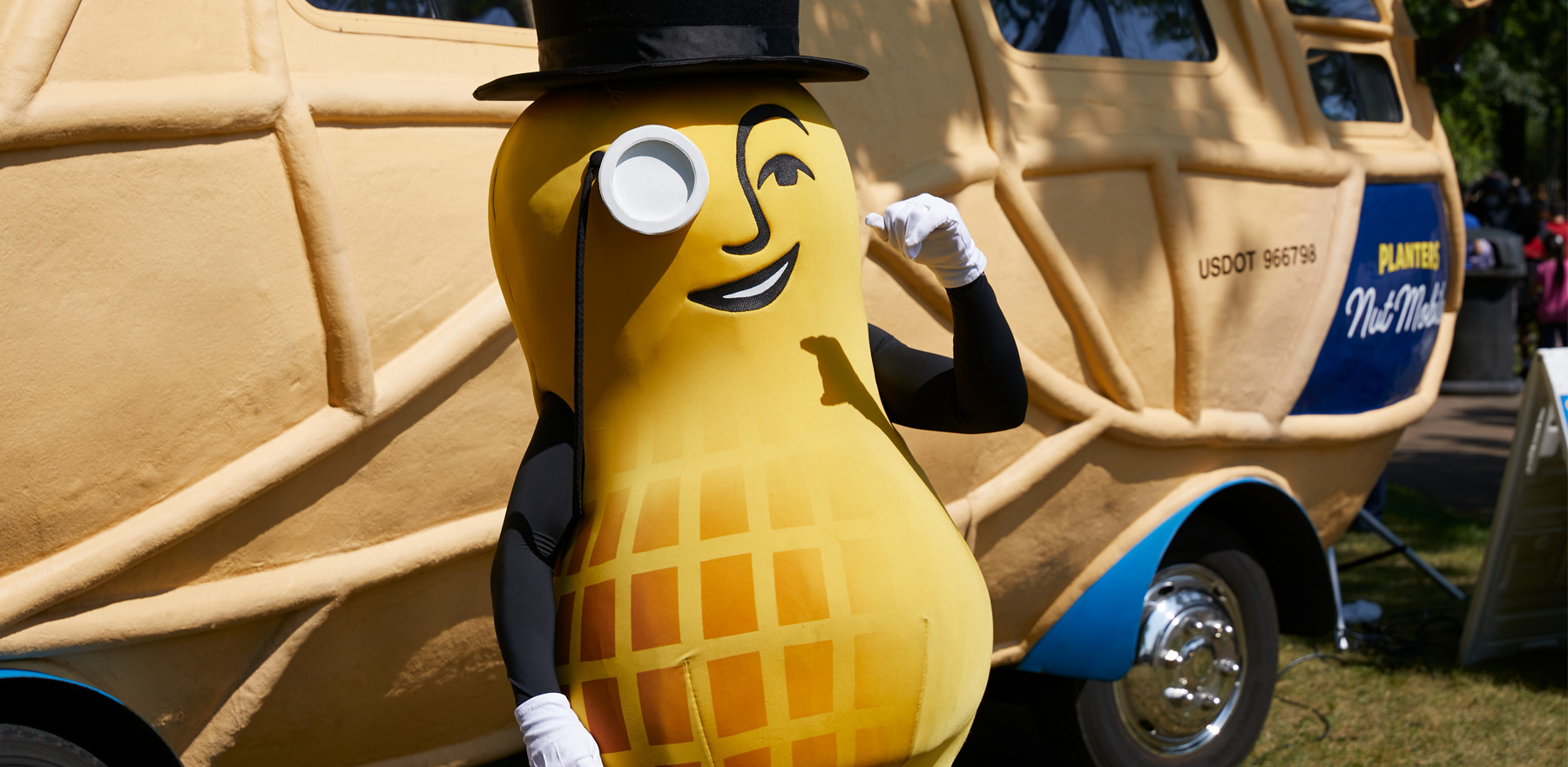 Mr Peanut standing in front of the Nutmobile