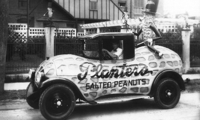 a black and white photo of the 1935 Planters Nutmobile