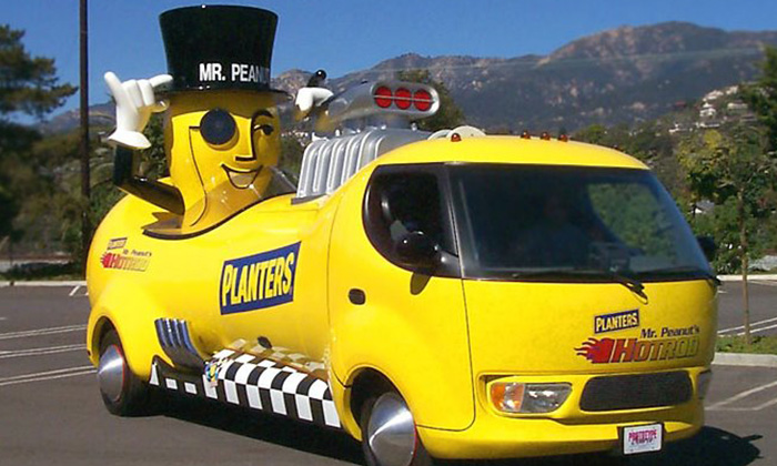 Mr Peanut riding in the 1999 Hot Rod in a parking lot